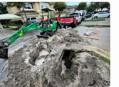Excavation access pit for trenchless sewer work